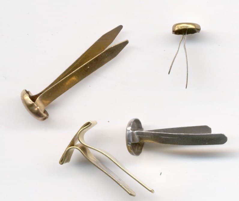 Brass Paper Fasteners: a Folded Strip under a Domed Cap