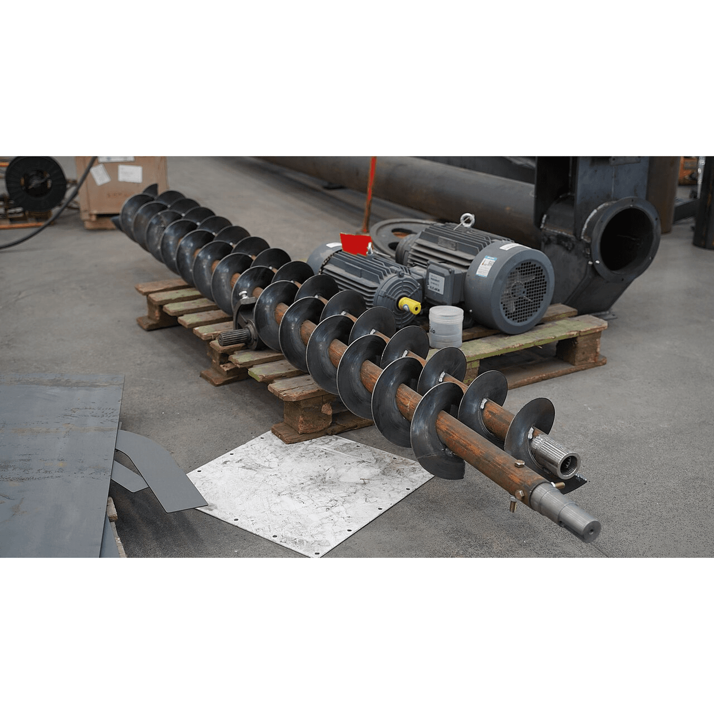 The Grain Auger: Archimedes' Screw Spun Fast in a Tube