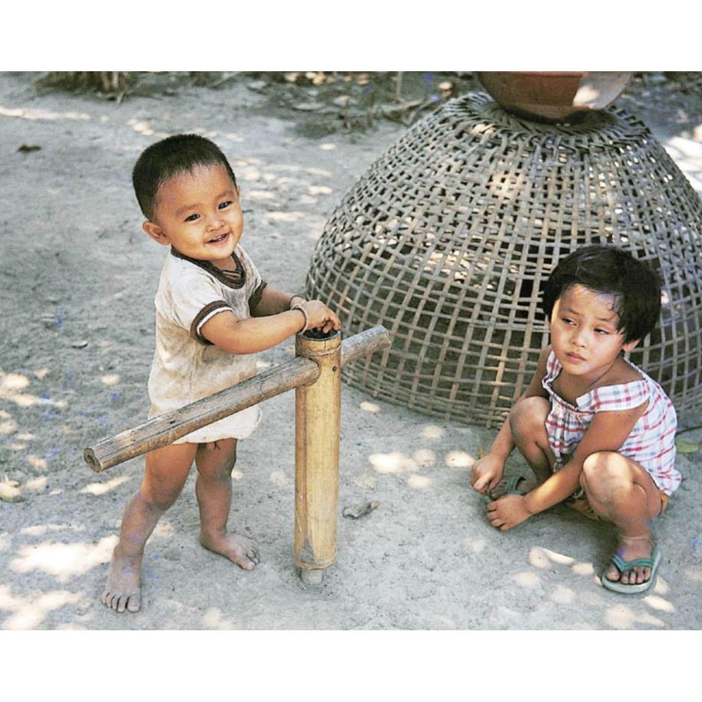 Krataeh Wian — a Bamboo Tube Turning on a Stake Helps a Child Learn to Walk