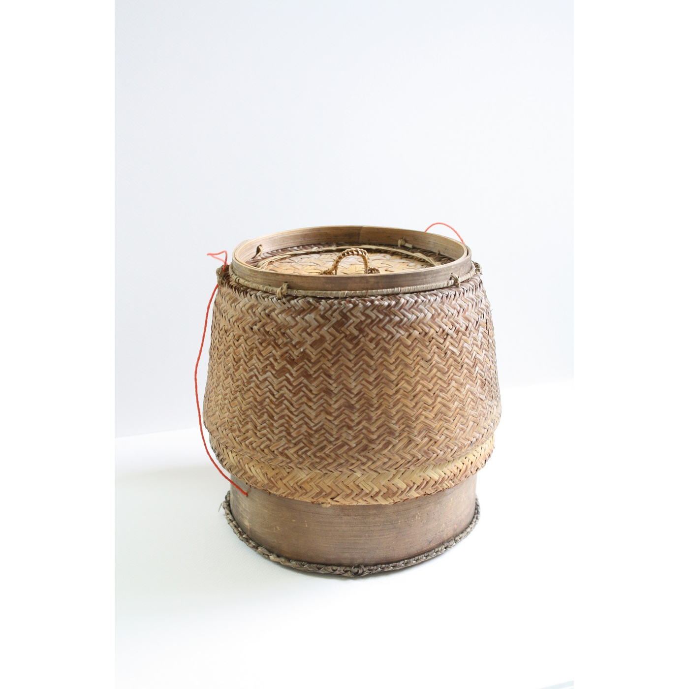กระติบ (krathip) — a Woven Bamboo Cylinder, Two Layers Deep, with a Fitted Lid, Keeps Steamed Sticky Rice Warm