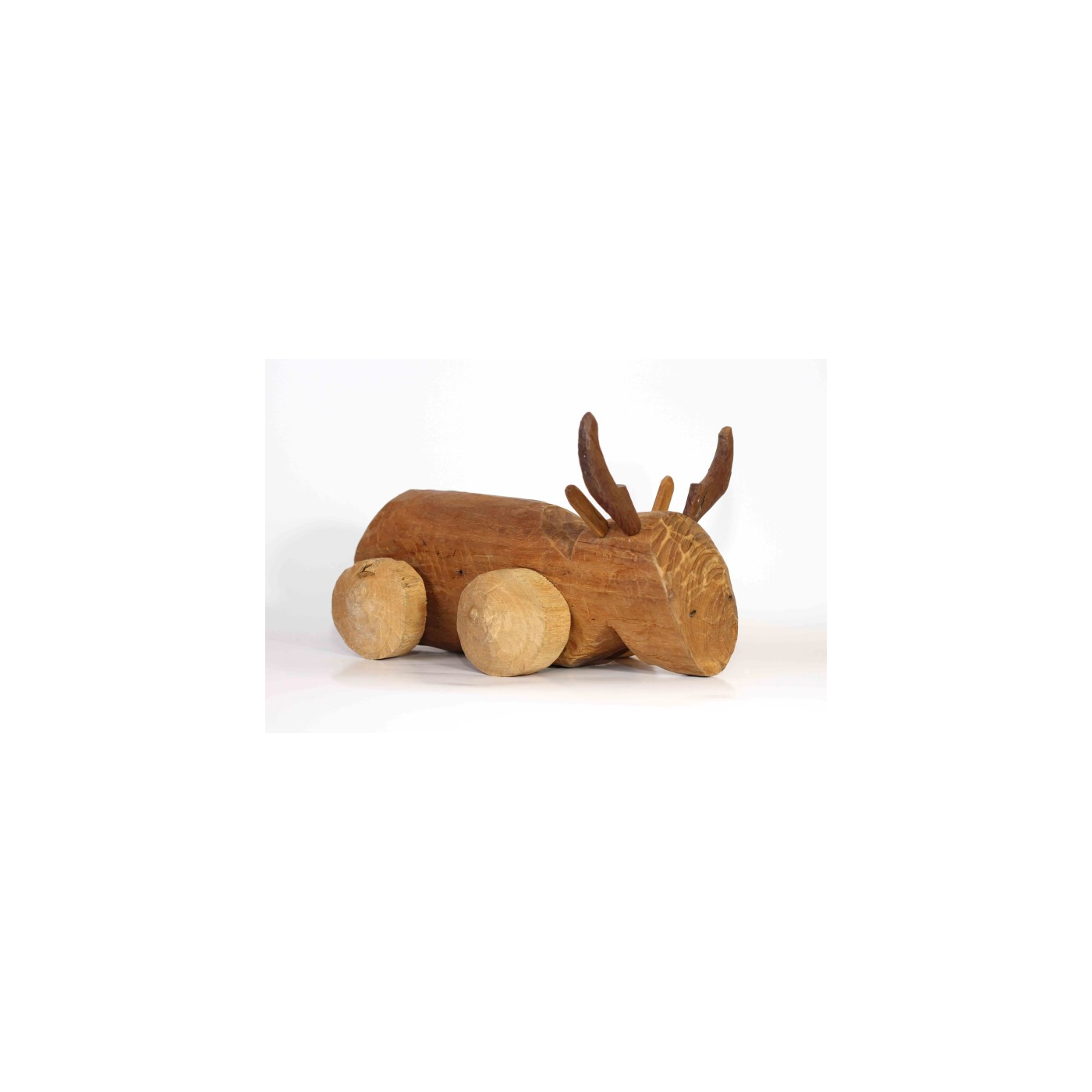 Sat Lo (Wheeled Wooden Animal) — a 3 × 12 × 3 cm Block Carved into an Animal, Four 3 cm Wooden Disc Wheels on Axles Thinner Than the Holes, with Horns, Ears and Tail; Pushed or Pulled Along