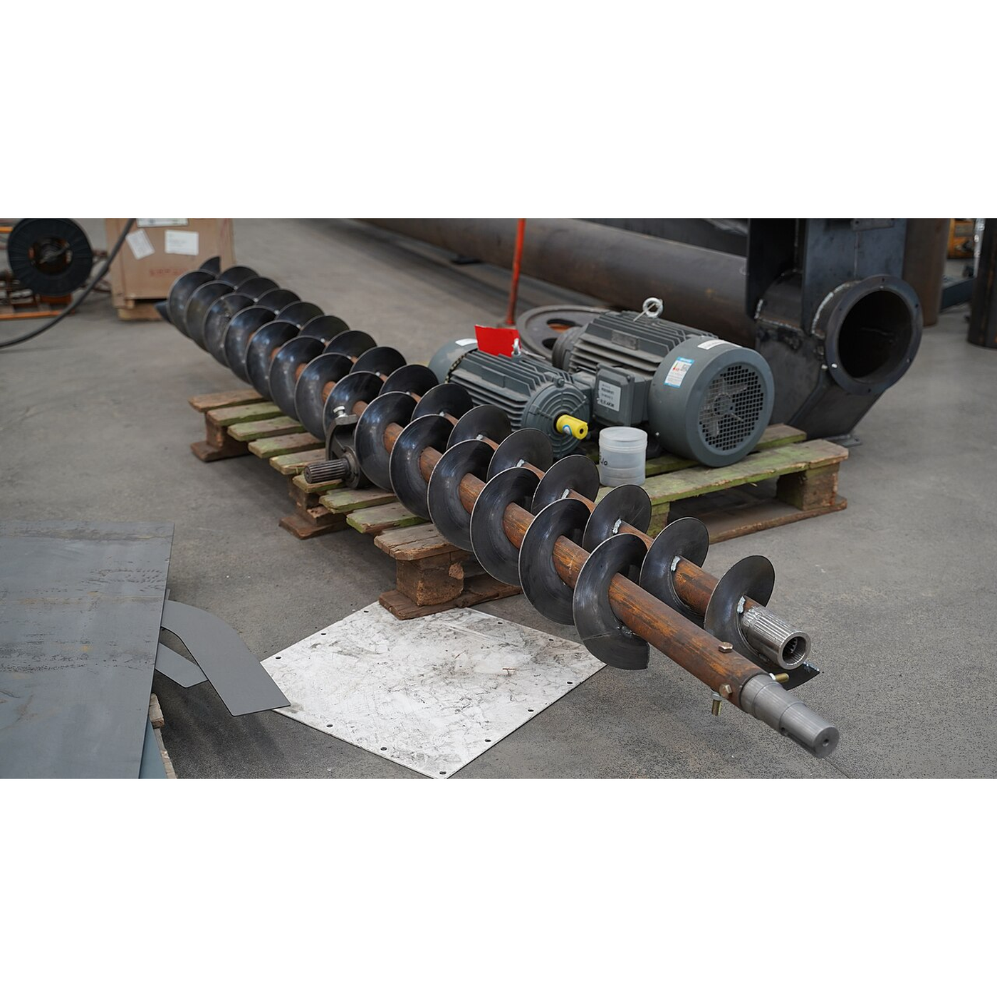 The Grain Auger: Archimedes' Screw Spun Fast in a Tube
